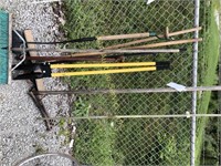 Garden tools including post hole digger and hoe,