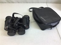 Tasco 7x35 zip focus binoculars with case.