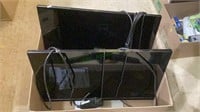 Two Dell computer monitors both with cords. Each