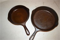 Two Unmarked Cast Iron Skillets