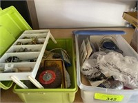 Container of picture hanger, nails, tackle box