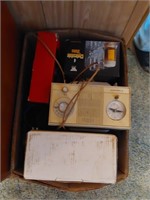 box with clock radio and miscellaneous items