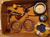 flat of pipes and ashtrays