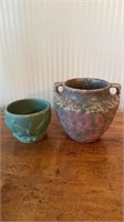 Two antique pottery vases, one with a green and