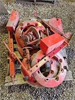 pallet of Farmall tractor weights, metal tool