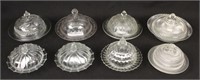 Eight Pressed Glass Butter Dishes