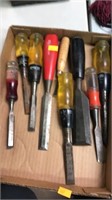 Flat of assorted chisels.