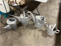 Galvanized watering cans.