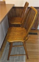 2 Oak swivel bar stools