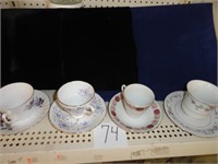 4 hand painted cups & saucers