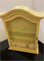 Vintage yellow curio cabinet with four shelves