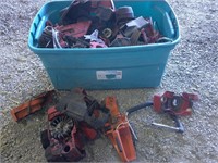 tote full of chainsaw parts