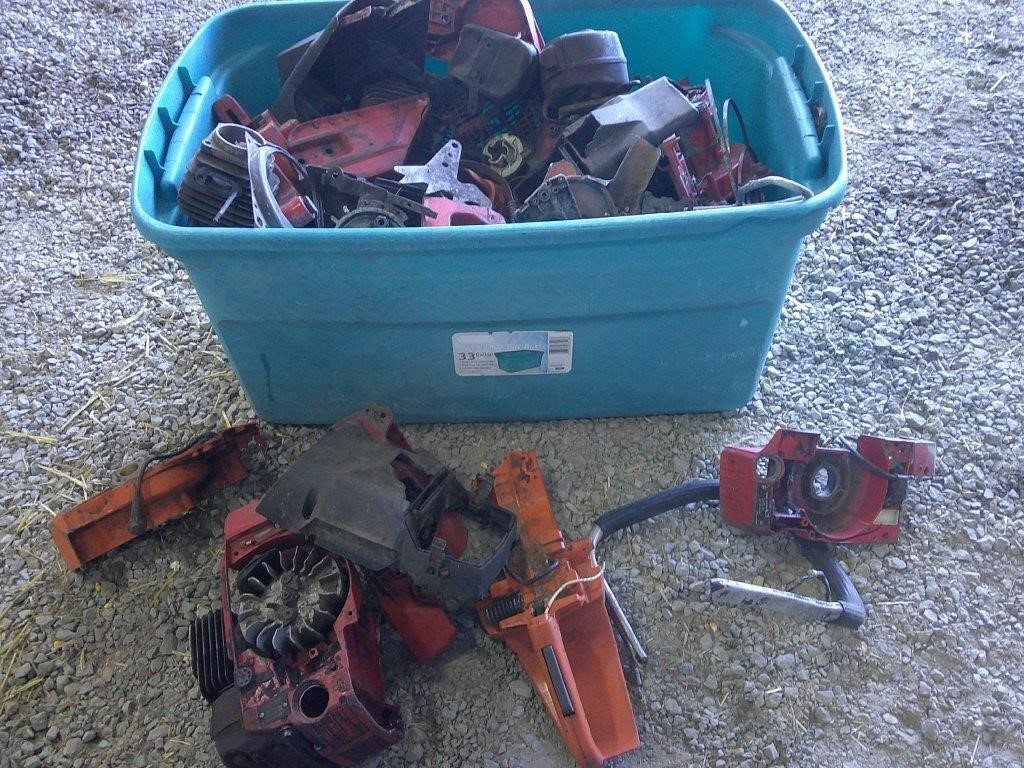 tote full of chainsaw parts