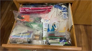 Drawer of assorted craft supplies with sharpies