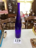 Large blue glass bottle
