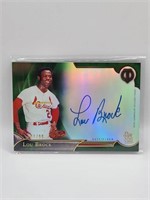 LOU BROCK AUTOGRAPHED TOPPS TRIBUTE CARD. NUMBER