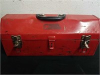 Vintage metal red toolbox with tools
