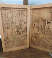 Pair of wood relief carvings signed Andre Boucher
