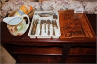 silverware, glass pitcher, wood tray,