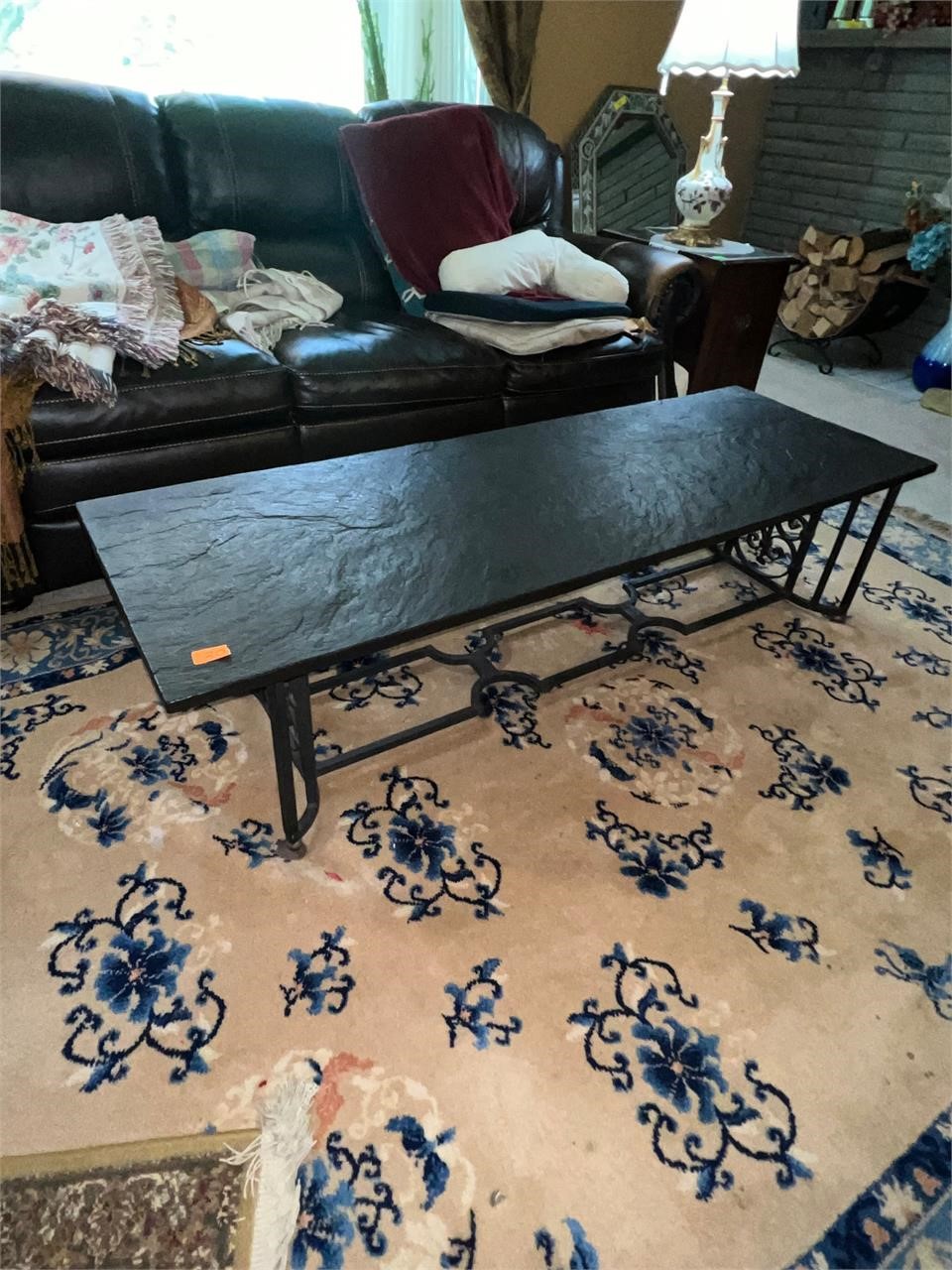 Wrought iron and stone top coffee table