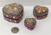 Three nesting jeweled hearts trinket boxes.   1930