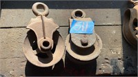 Antique metal wheeled pulleys