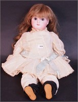 A 15" Bebe doll with pierced ears, composite