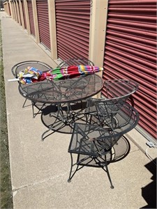 Wrought iron patio table w/ 4 chairs & Umbrella