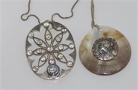 Two vintage silver pendants on silver chains