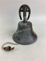 Metal horseshoe bell in good condition.