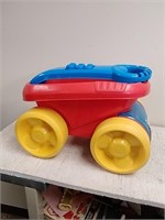 Child lego block scooping wagon