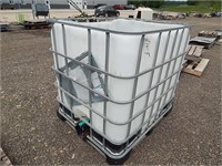 250 Gallon poly tank in a galvanized pallet cage;