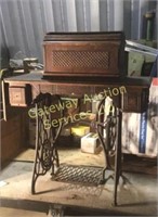 Singer sewing machine and cabinet.