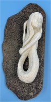 Elegant ivory carving by Susie Silook of a beautif