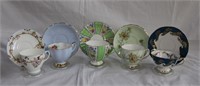 5 bone china cups and saucers plus 1 Canada cup