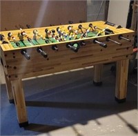 Foosball table in basement being your own help