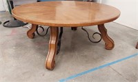 Round solid wood cocktail table. 41.5in diameter.
