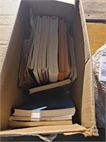 Box full of music books with electronic keyboard