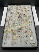 ASSORTED CHARMS AND BEADED NECKLACES