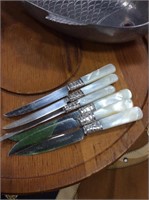 Six mother of pearl handled knives