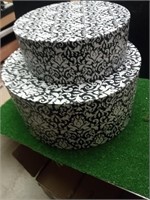 Two round matching decorative boxes