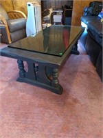 Heavy wooden coffee table with glass top