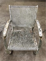 Metal patio rocking chair, weather worn
