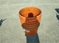 stack of large feed buckets