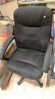 Black cushion office chair on five plastic