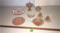 Pink carnival glass dishes, candle holders