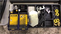 Crescent wrenches, drill bits, tape measures
