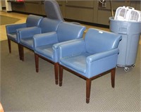 Four blue leather waiting room chairs