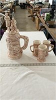 Large German style pottery stein with cups