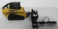 John Deere toy skidsteer with two attachments